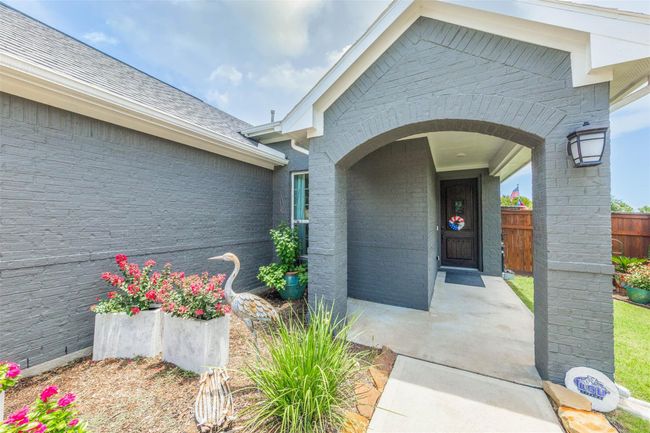 In the heart of the picturesque Bonterra Cross Creek Ranch, the front of this elegant property immediately captivates with its inviting charm. | Image 11