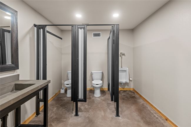 Bathroom featuring recessed lighting, concrete flooring, and a shower | Image 27