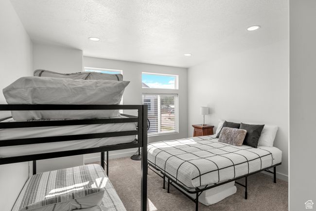 Bedroom featuring recessed lighting, baseboards, carpet, and a textured ceiling | Image 24