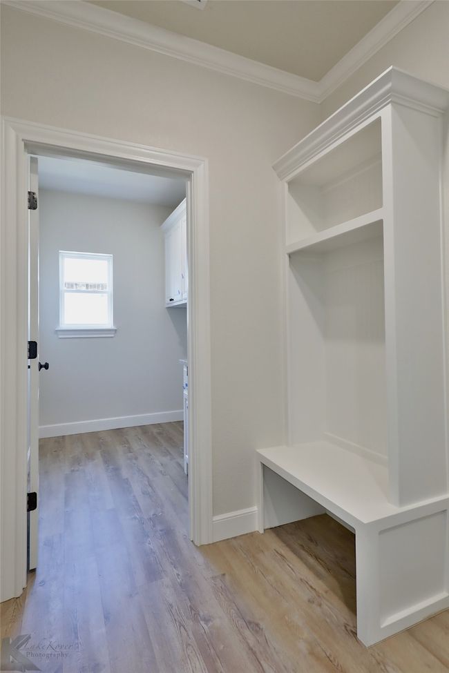 Mudroom with ornamental molding and light wood-type flooring | Image 30