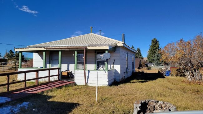 View of front of house with covered porch and a front lawn | Image 19