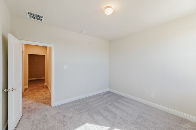 Carpeted spare room with baseboards | Image 23