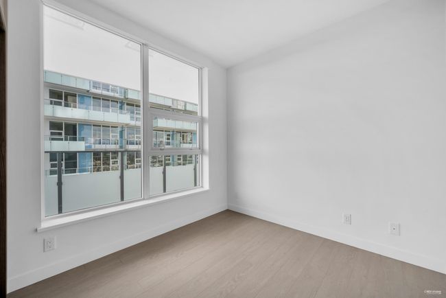 Spare room featuring baseboards and wood finished floors | Image 14