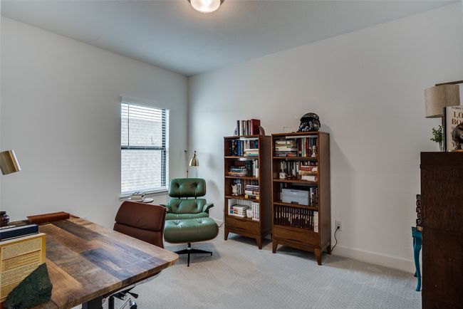 Home office with light colored carpet and baseboards | Image 10