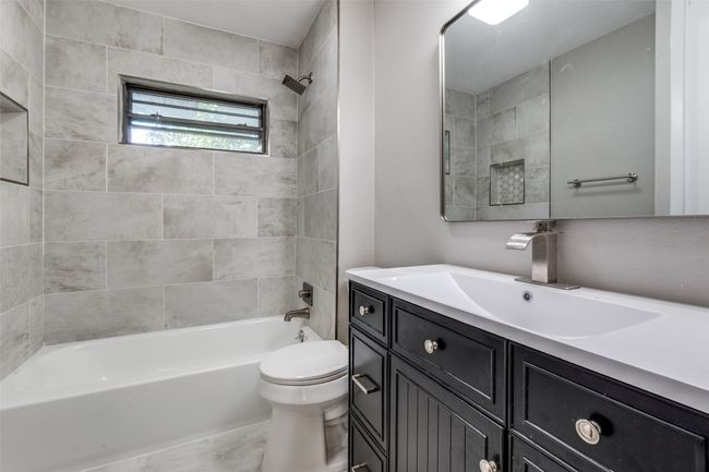 Full bath featuring vanity and shower / bathtub combination | Image 18
