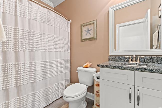 Bathroom with vanity, crown molding, and a shower with curtain | Image 21