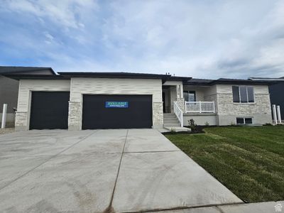 Prairie-style home featuring a front lawn and a garage | Image 2