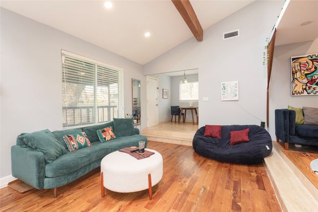 Family room opens to kitchen nook Step down from living area to family room | Image 28