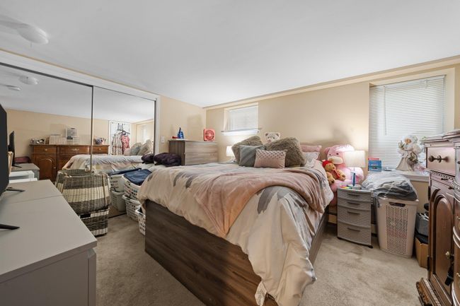 Exercise room with baseboards and carpet | Image 39