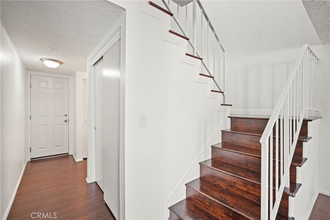 Downstairs: Door straight ahead lead to garage & laundry room. To the right is the 1/2 bathroom | Image 9