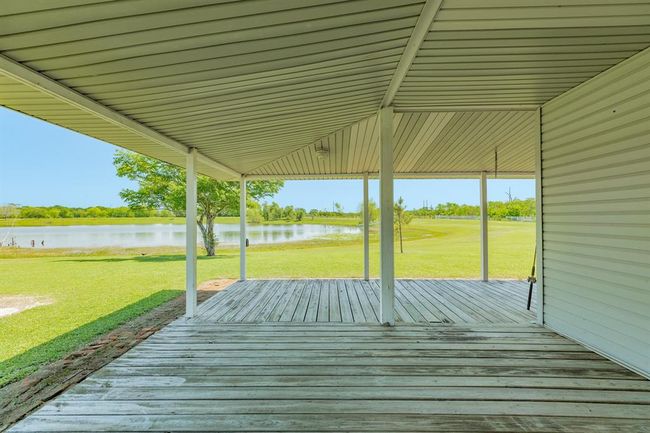 This wrap-around porch is a nice place to relax or if you are in the mood to entertain, you could set up tables for friends & family. | Image 12