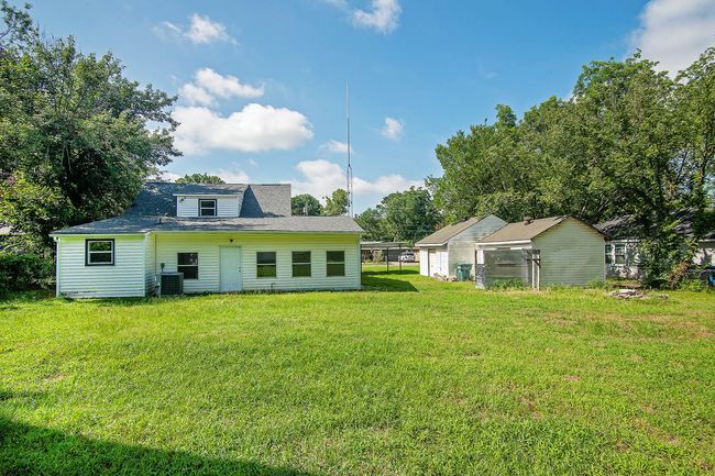 Rear view of property with a lawn | Image 30