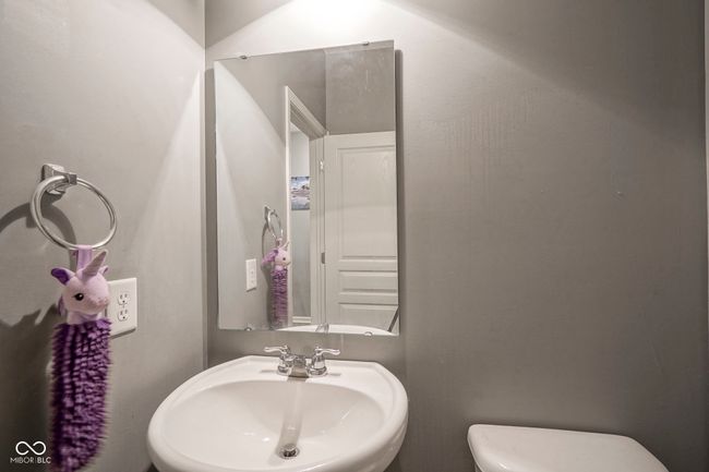 half bath featuring a sink and toilet | Image 33