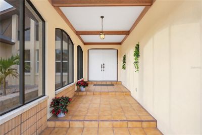 Screened-in front entryway with beautiful accents | Image 3