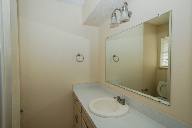 Half bath featuring vanity and toilet | Image 12