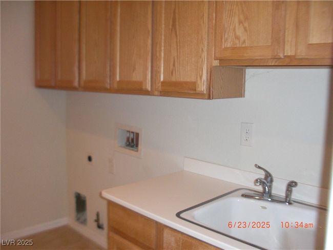 Laundry room with laundry sink Washer & Dryer installed at no additional expense. | Image 7