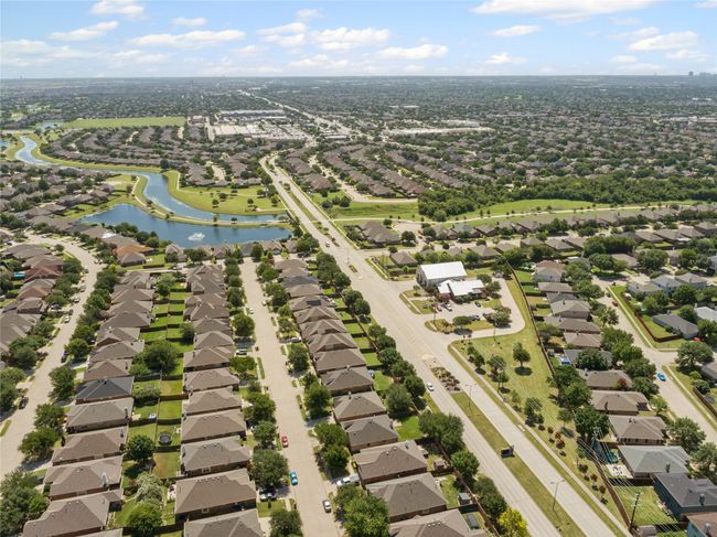 Aerial view of residential area featuring a nearby body of water | Image 37