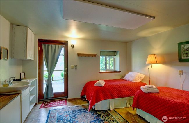 Sleeping area on main floor of lodge | Image 11