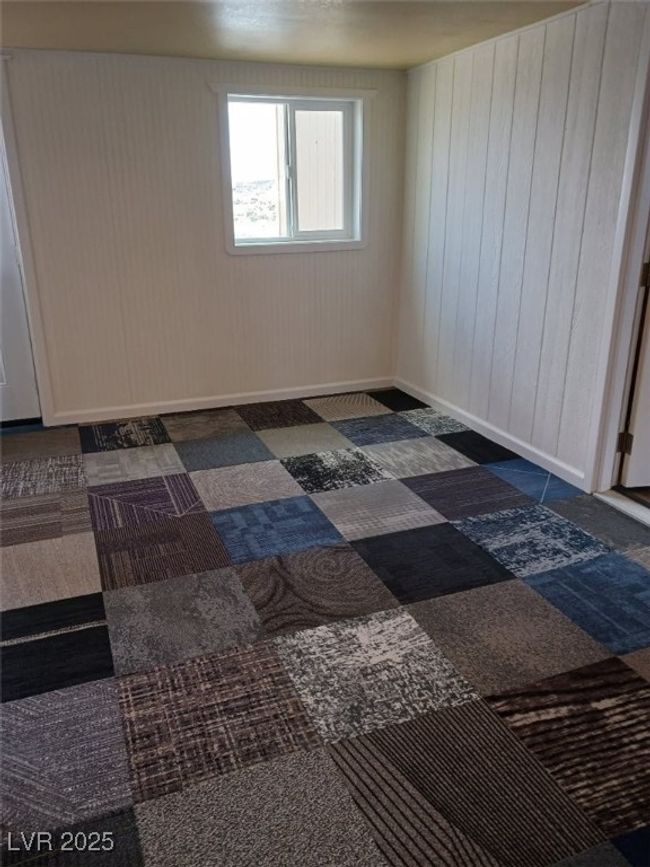 Empty room featuring baseboards | Image 15