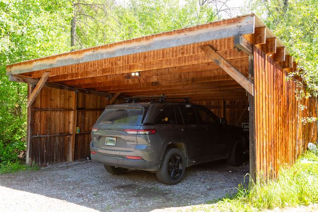 View of car parking featuring a detached carport | Image 37
