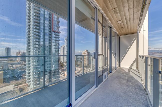 Balcony featuring a view of city | Image 13