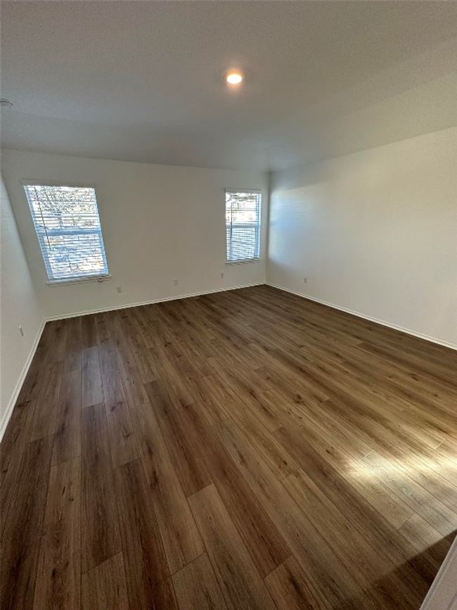 Unfurnished room featuring recessed lighting, baseboards, and dark wood-style flooring | Image 12