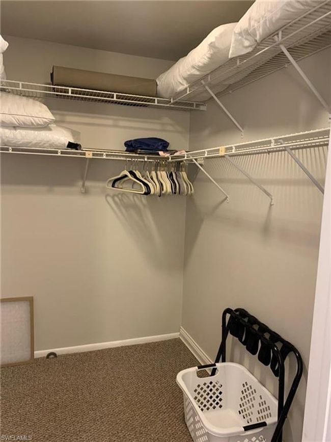 Walk in closet featuring carpet flooring | Image 16