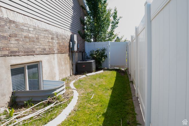 View of yard featuring central AC unit | Image 38