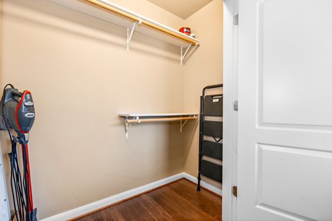 Spacious closet featuring wood finished floors | Image 16