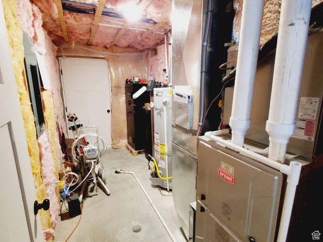 Unfinished basement with gas water heater | Image 34