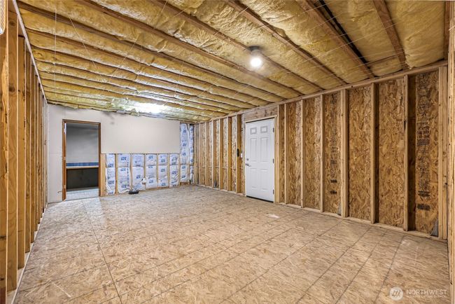 Another deck out this door in the unfinished area, entrance to a built-in desk room | Image 33