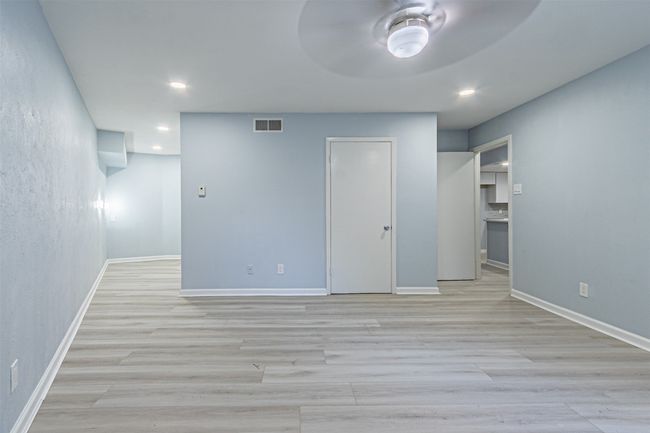 Unfurnished room featuring ceiling fan and light wood-type flooring | Image 26