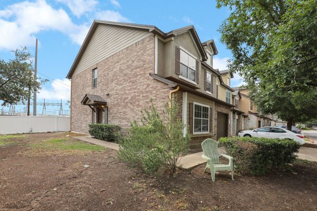 View of home's exterior featuring fence and brick siding | Image 5