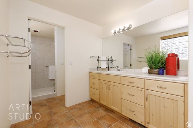 Bathroom featuring tiled shower and vanity | Image 27