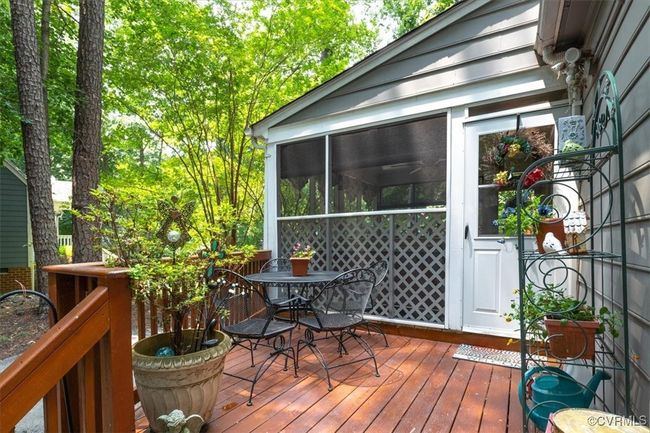 Wooden terrace with outdoor dining area and a sunroom | Image 43