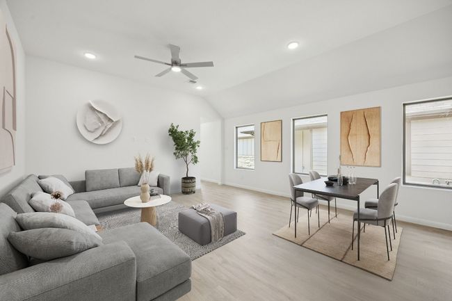 Living room with light wood-style floors, lofted ceiling, a ceiling fan, and recessed lighting | Image 15