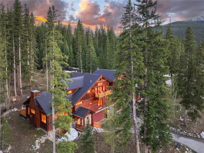 Cabin in the woods at dusk | Image 1