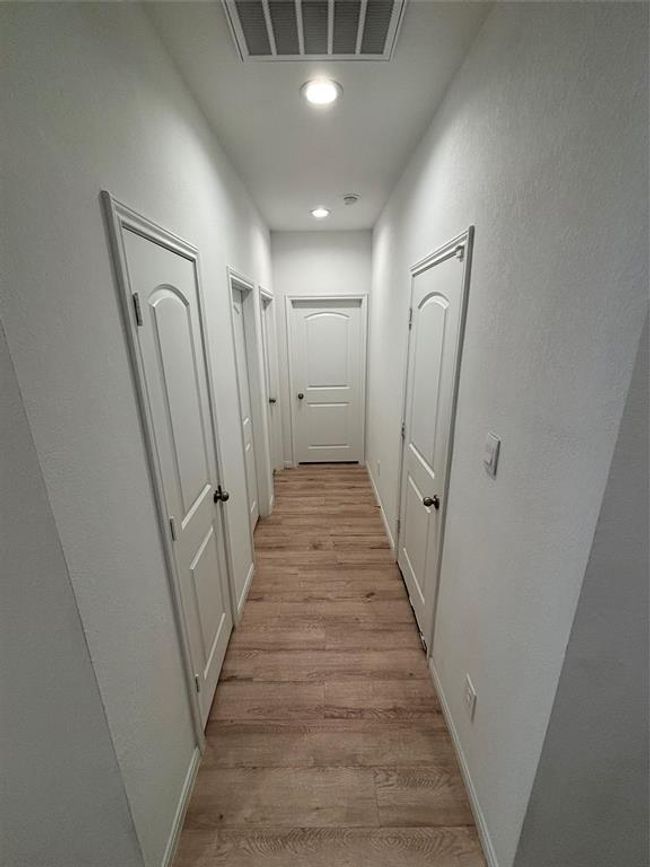 Hall to bath, laundry room and bedroom | Image 17