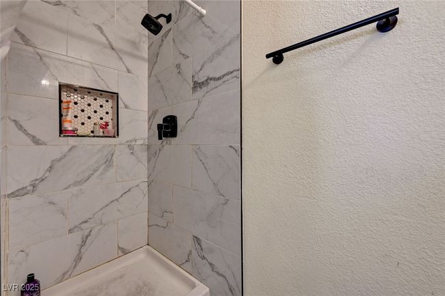 Full bathroom featuring a tile shower | Image 32