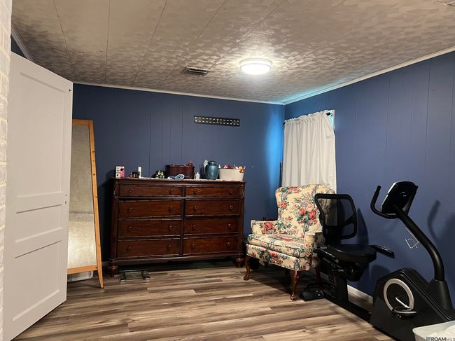 Large primary bedroom allows you to have extra dressing space, have a makeup vanity, or just a space to sit and watch tv. | Image 7