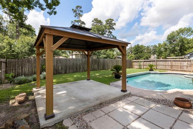 Create an inviting outdoor living space as you relax under the gazebo, enjoy the cool pool and ample privacy with no rear neighbors. | Image 26