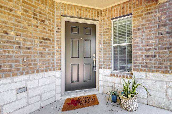 Lovely front porch area to keep you family and friends out of the weather. This is such a wonderful place to decorate for the seasons and holidays too. | Image 35