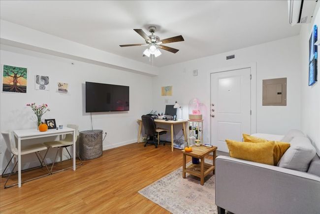 This angle showcases the living room and the sizeable living area. | Image 5