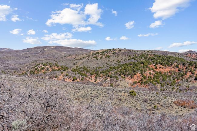 View looking ne from middle ridge with ranches fence line boundary visible. | Image 67