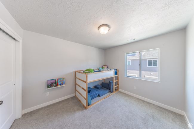 Upstairs bedroom featuring carpet, large windows and a closet | Image 17