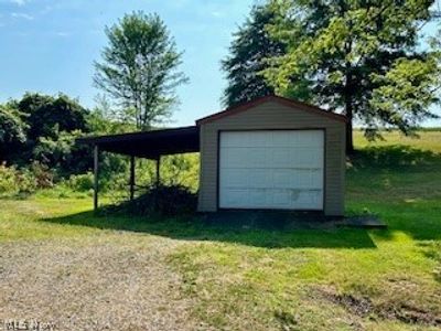 Garage with a carport | Image 3