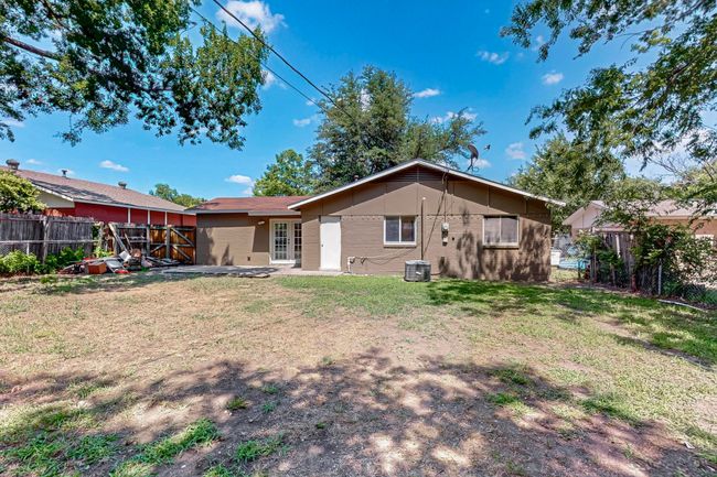 Rear view of property featuring a fenced backyard | Image 26