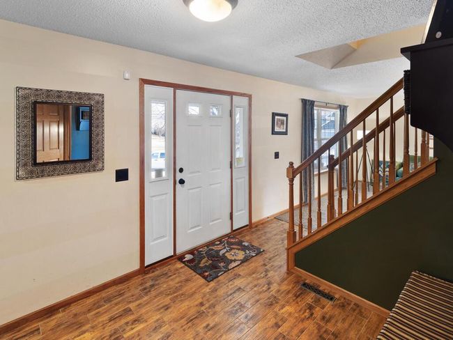 Spacious foyer with tiled floors | Image 9