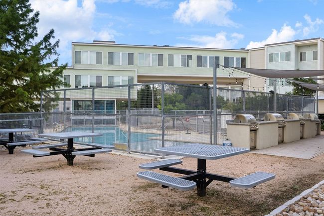 Surrounding community featuring an outdoor kitchen and a pool | Image 26