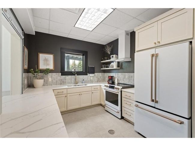 Your assoc fees include full access to the walkable and beautiful Waters Edge Community Center! pool, gym, and party room with kitchen! | Image 23